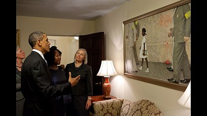 President Barack Obama, Ruby Bridges, and representatives of the Norman Rockwell Museum view Rockwells "The Problem We All Live With, hanging in a West Wing hallway near the Oval Office, July 15, 2011. Bridges is the girl portrayed in the painting. (Official White House Photo by Pete Souza)